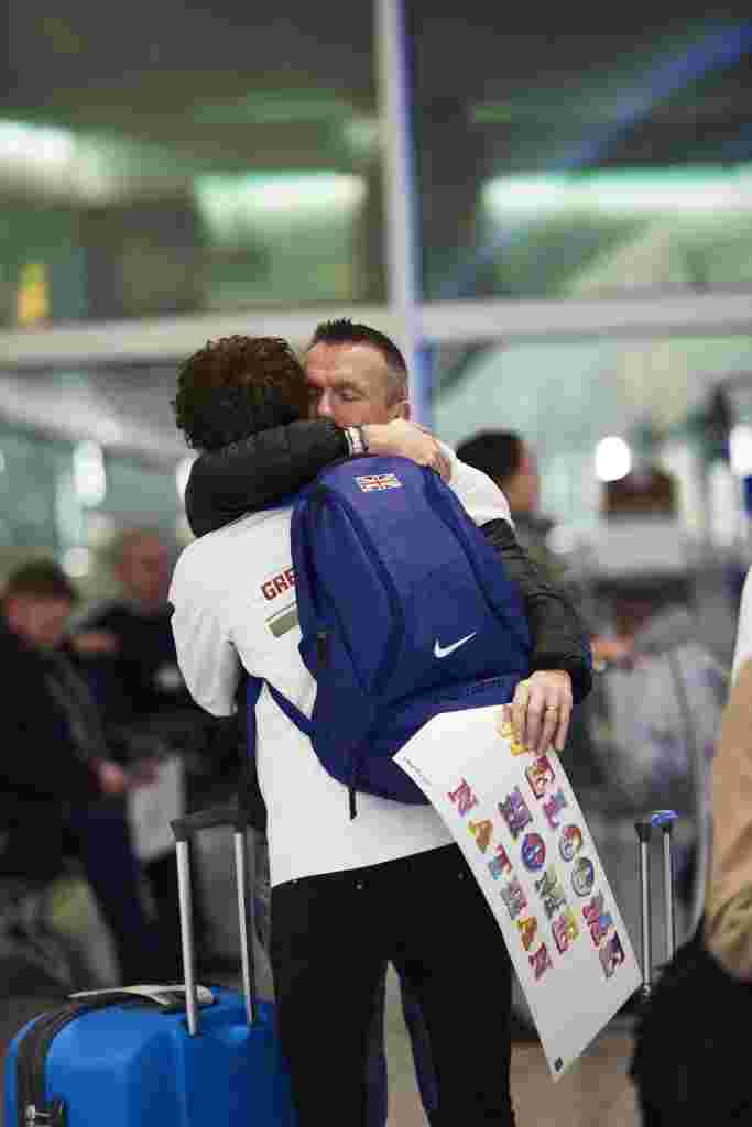 Heathrow Terminal 2, Tuesday 6th December, 2016: Father welcomes home son Nathan at Heathrow Terminal 2, with personalised welcome home banner from London street artist Ben Eine   This Christmas, Heathrow is giving every passenger the chance to have their own heartfelt reunion in arrivals just as teddy bears Doris and Edward* did in their Christmas film. To celebrate those tender moments, the airport has partnered with prolific London-based street artist, Ben Eine, to create a range of personalised banners, for family and friends to make greeting their loved ones extra special this year. PR Handout - free for editorial usage. For more information, an interview with Ben Eine or further images please contact Emily.Stallard@onegreenbean.com/ 0207 467 9246.  Copyright: © Mikael Buck / Heathrow