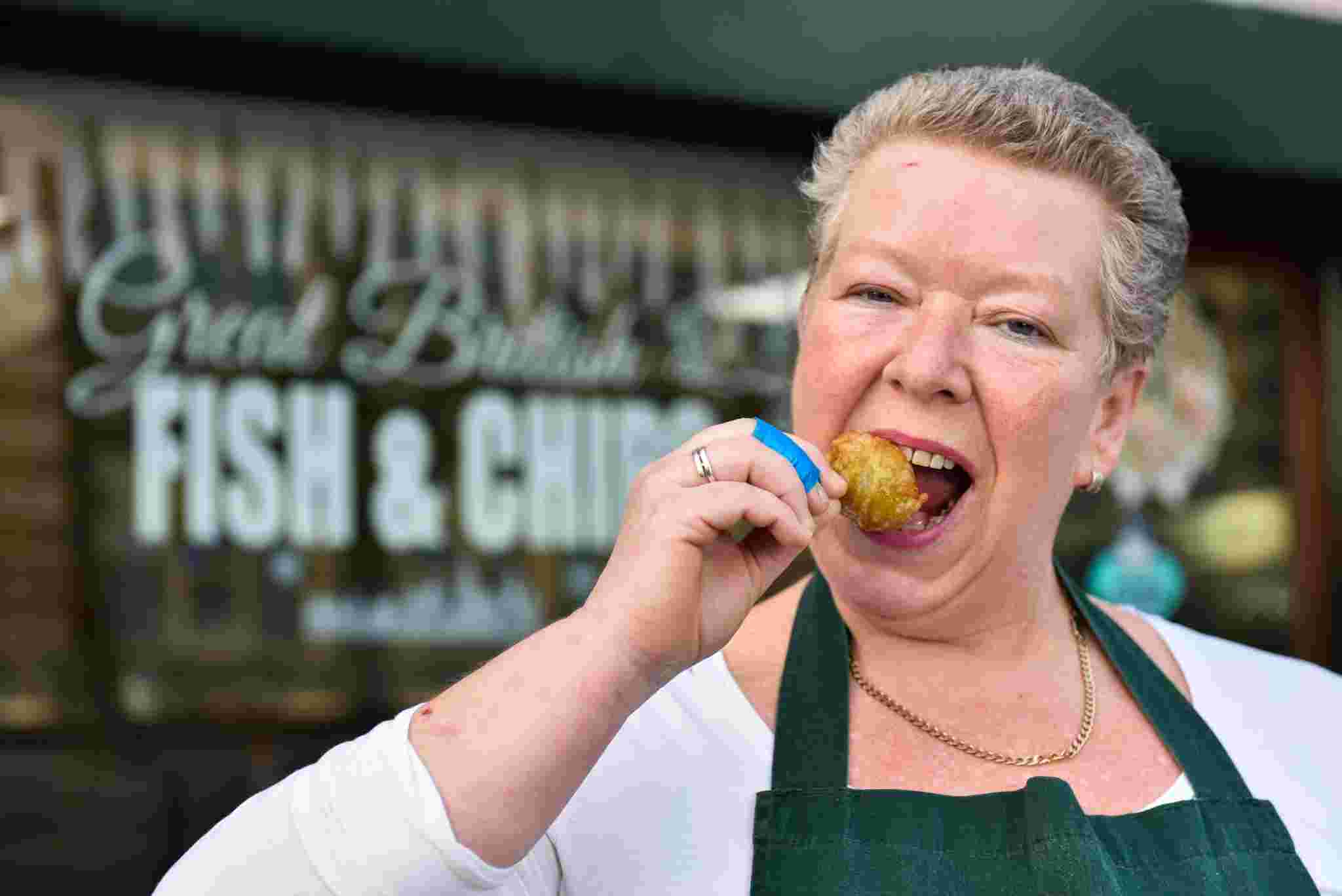 Andrea Long, 51, sells battered Brussels sprouts at Terrys Traditional Fish and Chips in Huddersfield, West Yorks., December 06 2016. See Ross Parry story RPYSPROUT: Battered sprouts are proving a huge Christmas hit at a fish and chips shop. People are flocking to Terry’s Traditional Fish and Chips in Huddersfield, Yorkshire, after it added the dish to its Christmas menu. And they have been amazed at the reaction to the new ‘Yorkshire delicacy’,which is being given to customers as a Christmas gift. The sprouts are the idea of manager Andrea Long. But she has been stunned by the demand with 150 portions going out to regulars and they all say they love the battered sprouts, including children. Only two customers gave the sprouts the thumbs down.