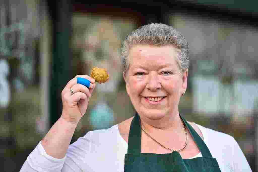 Andrea Long, 51, sells battered Brussels sprouts at Terrys Traditional Fish and Chips in Huddersfield, West Yorks., December 06 2016. See Ross Parry story RPYSPROUT: Battered sprouts are proving a huge Christmas hit at a fish and chips shop.  People are flocking to Terry’s Traditional Fish and Chips in Huddersfield, Yorkshire, after it added the dish to its Christmas menu.  And they have been amazed at the reaction to the new ‘Yorkshire delicacy’,which is being given to customers as a Christmas gift.  The sprouts are the idea of manager Andrea Long.  But she has been stunned by the demand with 150 portions going out to regulars and they all say they love the battered sprouts, including children. Only two customers gave the sprouts the thumbs down.