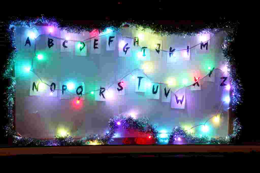 Giles Wallwork with his 'Stanger Things' Christmas display.  A house in Birmingham is captivating passers-by with its Stranger Things-inspired festive light display in the front window.  See NTI story NTISTRANGER.  The flashing lights scroll through the letters to spell out Merry Christmas in a homage to the popular Netflix show, starring Winona Ryder.  The man behind it - Giles Wallwork - said he had the idea in November and looked up blueprints on how to get the lights to work.