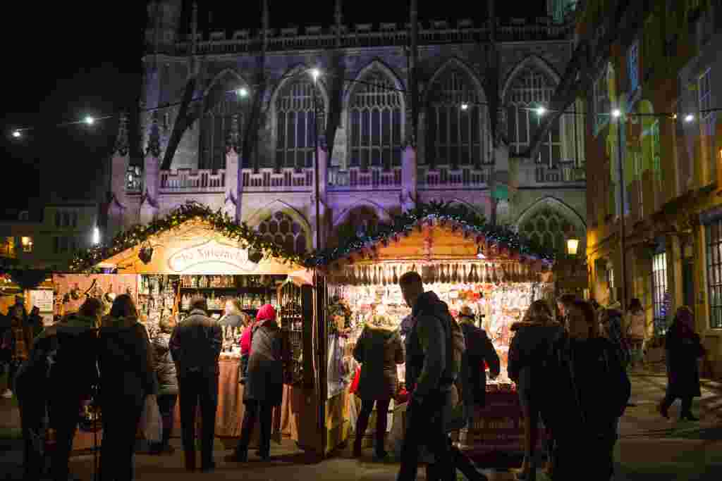 The Christmas Market in Bath, Somerset.  See SWNS story SWXMAS.  It's the most wonderful time of the year - time to wrap up warm, drink steaming hot drinks and find unique gifts for your loved ones.  And where better to stock up on festive cheer than one of the hundreds of amazing Christmas markets located in some of the most scenic settings, in towns and cities over the festive period. From Big Wheels, to tiny trinkets these winter wonderlands have something for everybody including beer halls, ice rinks and carousels.