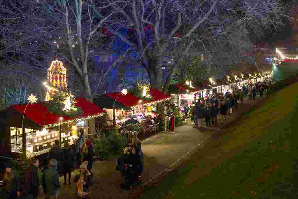 Edinburgh's Christmas Market in Princes Street Gardens.   See SWNS story SWXMAS.  It's the most wonderful time of the year - time to wrap up warm, drink steaming hot drinks and find unique gifts for your loved ones.  And where better to stock up on festive cheer than one of the hundreds of amazing Christmas markets located in some of the most scenic settings, in towns and cities over the festive period. From Big Wheels, to tiny trinkets these winter wonderlands have something for everybody including beer halls, ice rinks and carousels.