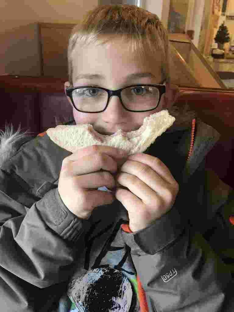 William enjoying a sandwich