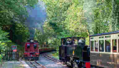 Garratt No.60 “Drakensberg” arrives at Aberffrwd station in July 2024, passing No.8 “Llewelyn”. Photo: Andrew Simmonds.